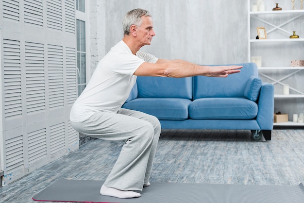 Free photo senior man exercising at home