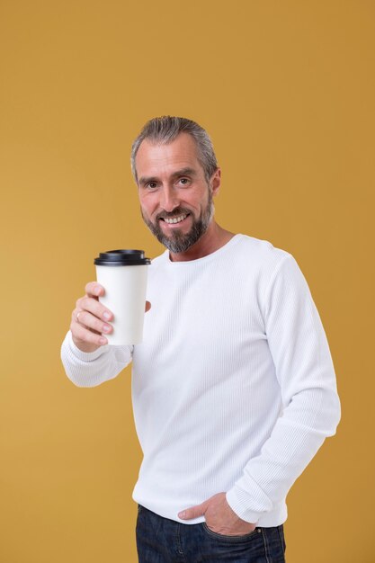 Senior man holding a cup of coffee