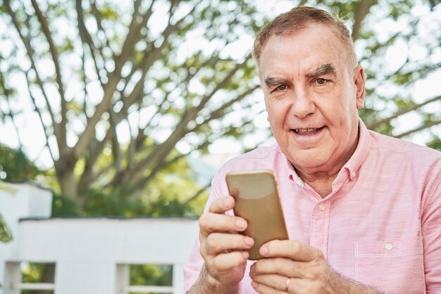 Senior man using mobile app