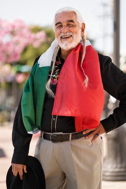 Senior man wearing mexican flag side view