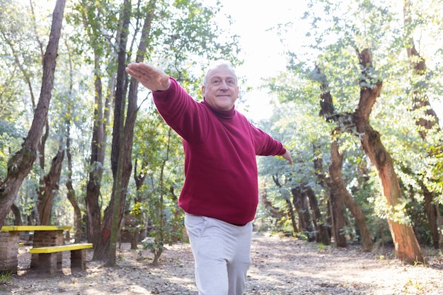 Free photo senior man with sweatshirt exercising