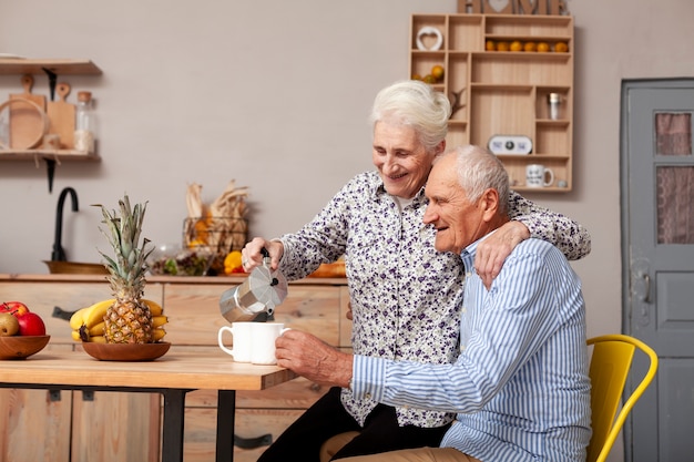 Senior man and woman having coffee