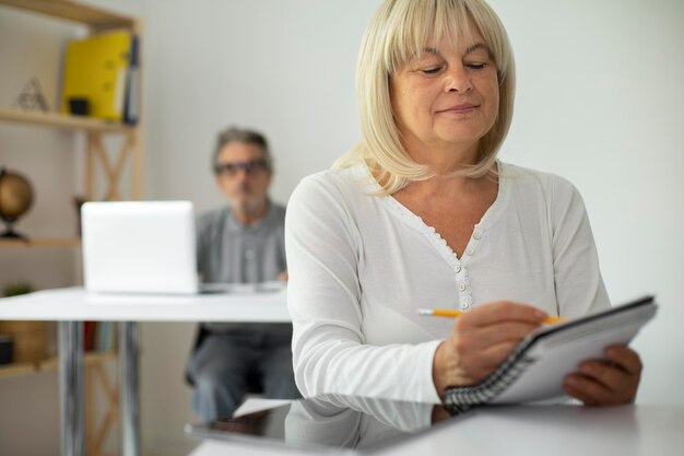 Senior man and woman paying attention in class