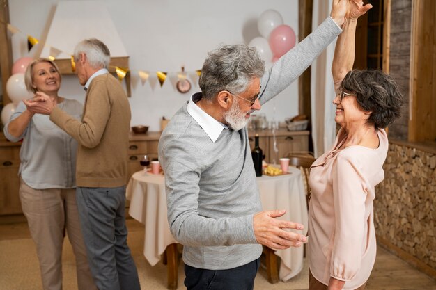 Senior people dancing at party