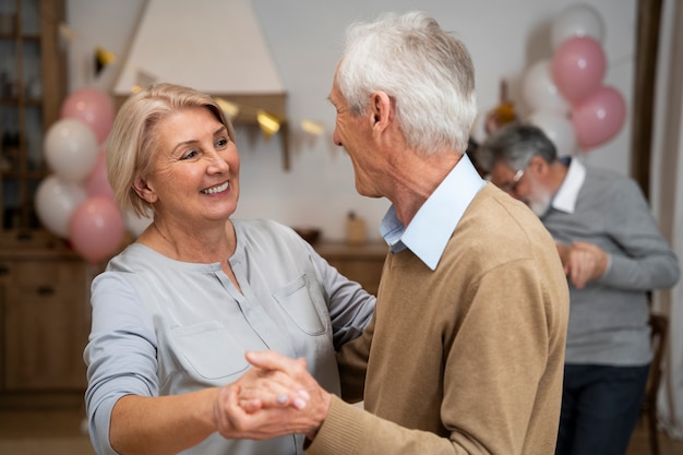 Senior people dancing at party