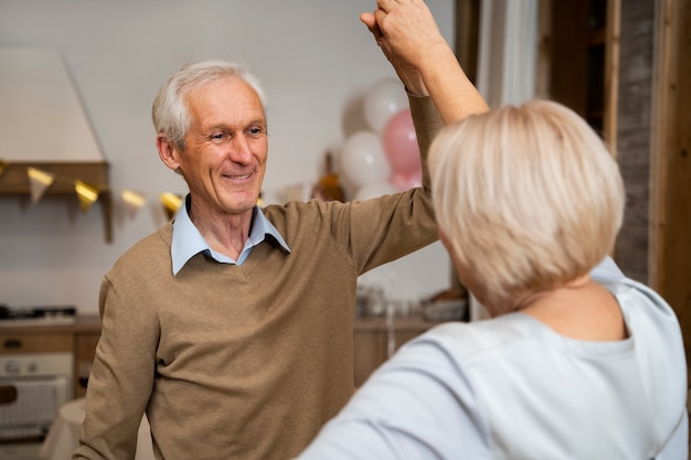 Senior people dancing at party