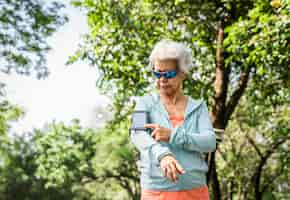 Free photo senior runner using a fitness tracker