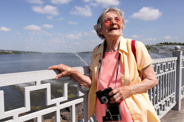 Senior traveler holding a camera