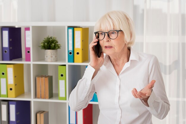 Senior with eyeglasses talking on the phone