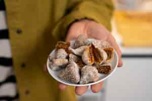 Free photo senior woman having fig fruits at home