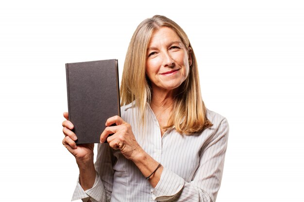 Senior woman holding a black book