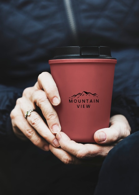 Free photo senior woman holding reusable travel mug