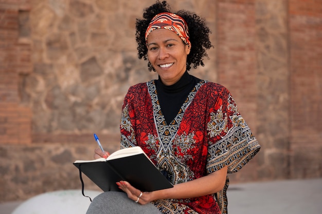 Senior woman journaling outdoors