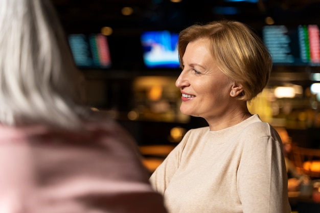 Senior woman smiling at a restaurant