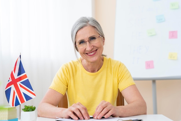 Senior woman teaching english lessons at home