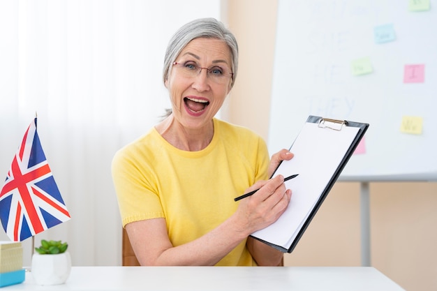 Senior woman teaching english lessons at home