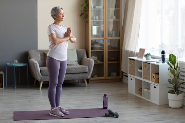 Senior woman training at home