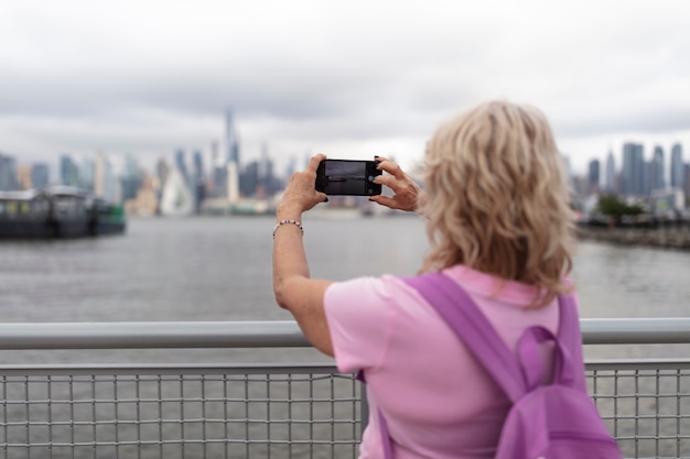 Free Photo senior woman traveling areound the world