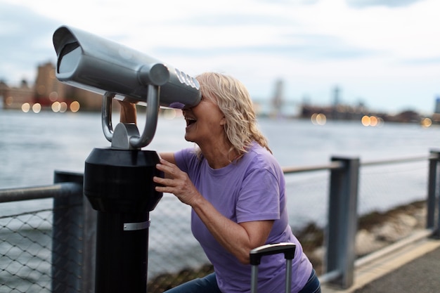 Senior woman traveling areound the world