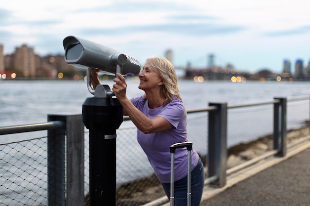 Senior woman traveling areound the world