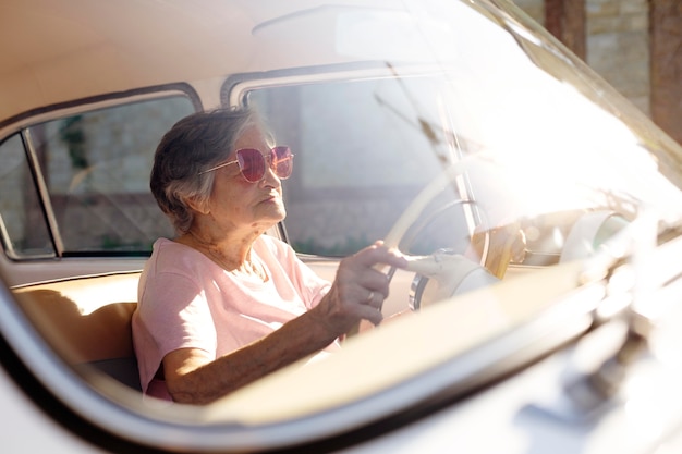 Senior woman traveling by car