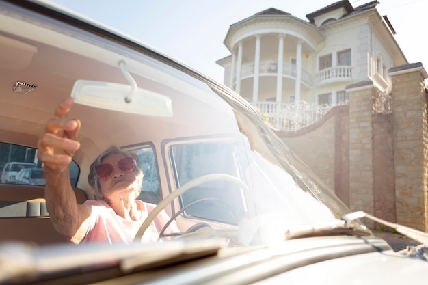 Senior woman traveling by car