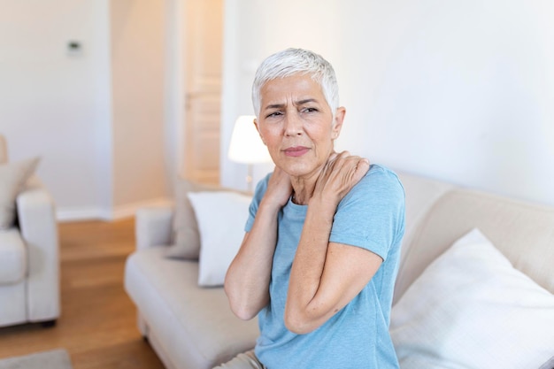 Free photo senior woman with shoulder pain elderly woman is enduring awful ache shoulder pain in an elderly person senior lady with shoulder pain