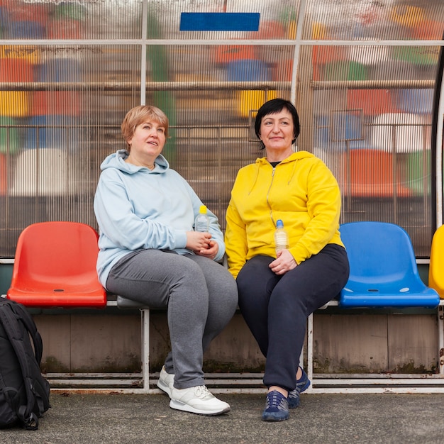 Senior women at stadium resting