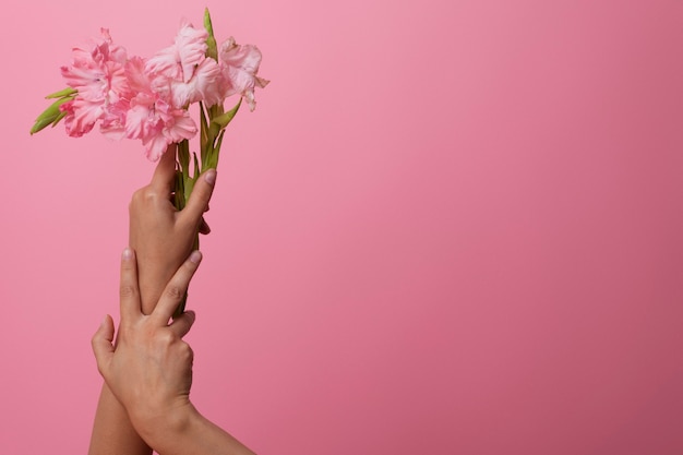 Sensitive hand with beautiful flower