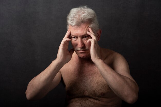 Sensitive old man portrait in studio