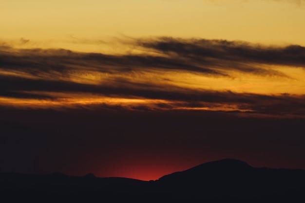 Free Photo sepia clouded sky at sundown