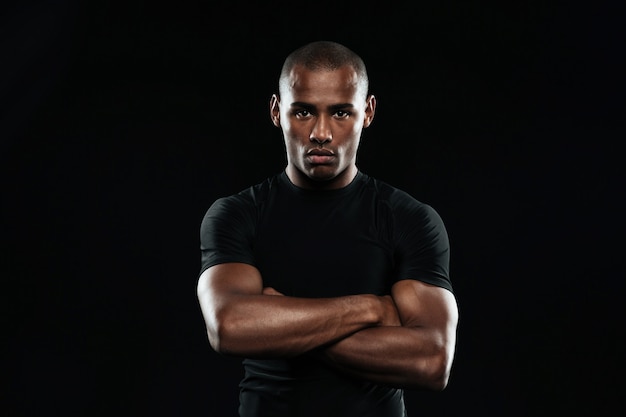 Serious afro american sports man looking at camera