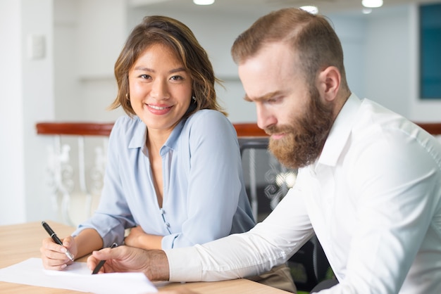 Free Photo serious boss checking documents