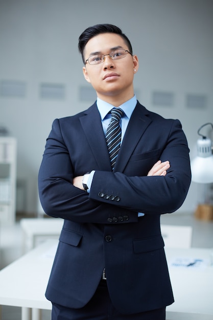 Serious businessman with crossed arms