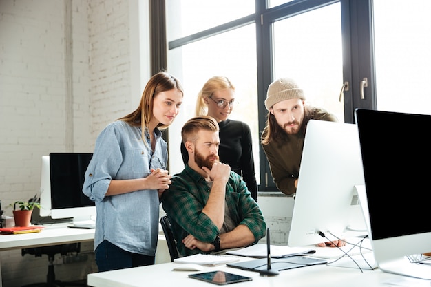 Serious colleagues in office talking with each other