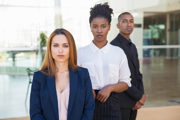 Free photo serious confident female business leader posing in office