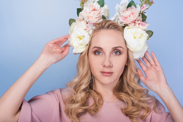 Serious lady with flowers on head 