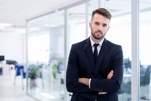 Serious man in suit with crossed arms