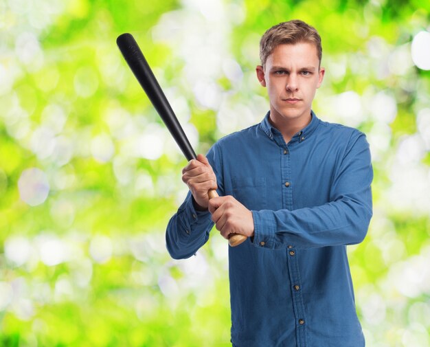 Serious man with a baseball bat