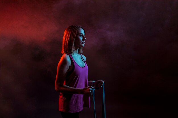 Serious model with sport equipment in studio