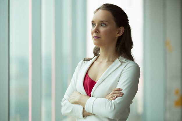 Serious smart businesswoman thinking of propensity