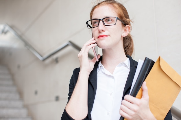 Serious Student Calling on Phone on Staircase