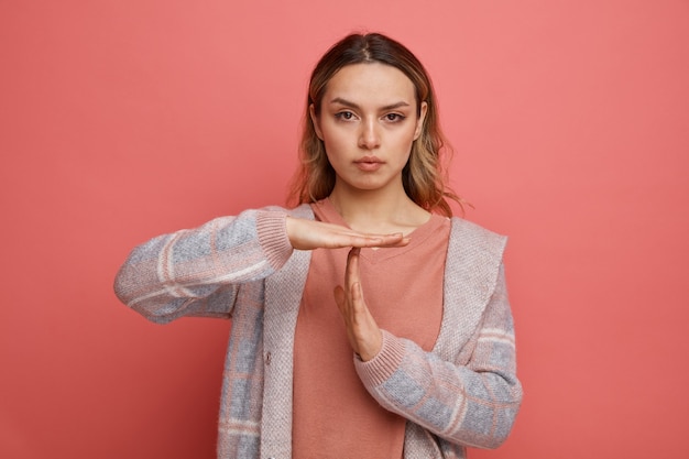 Free photo serious young girl doing timeout gesture