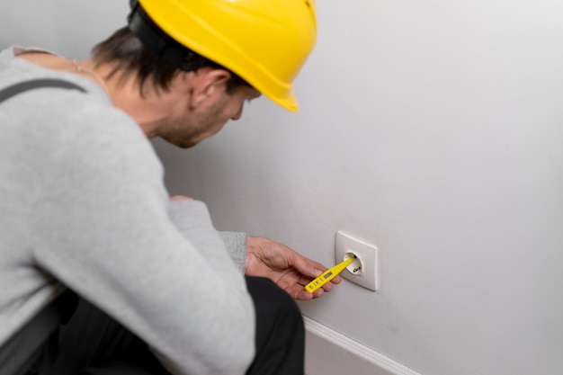 Service maintenance worker repairing