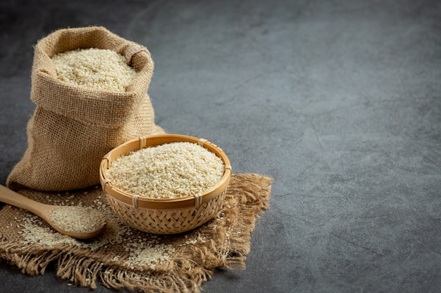 Sesame seeds on dark background