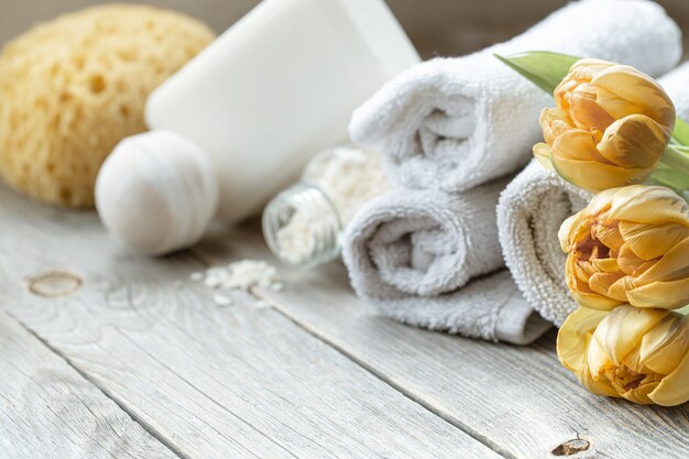 A set of bath accessories on a wooden surface. Health and beauty concept.