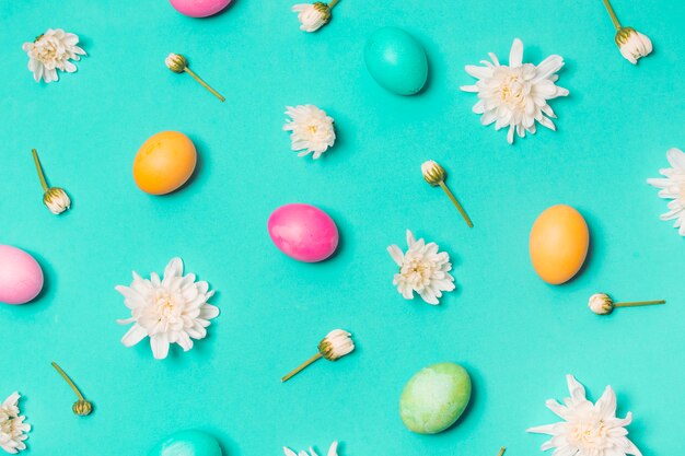 Set of bright eggs between flower buds