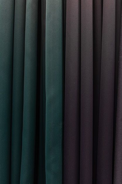 Free photo set of dark multi-colored dense fabrics of uniform texture, choice of materials in different colors.