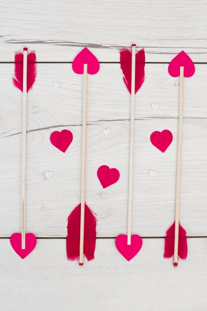 Set of decorative feathers on wands with little hearts