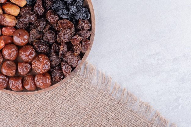 Set of dried fruits on a wooden platter